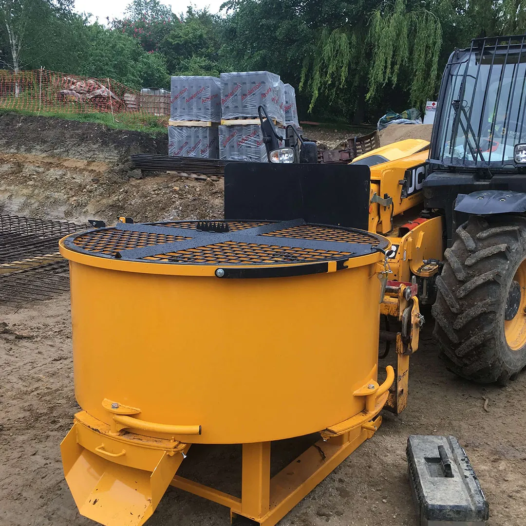 a large yellow machine sitting on top of a dirt field