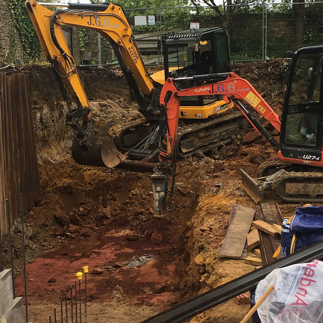 a bulldozer digging a hole in a construction site