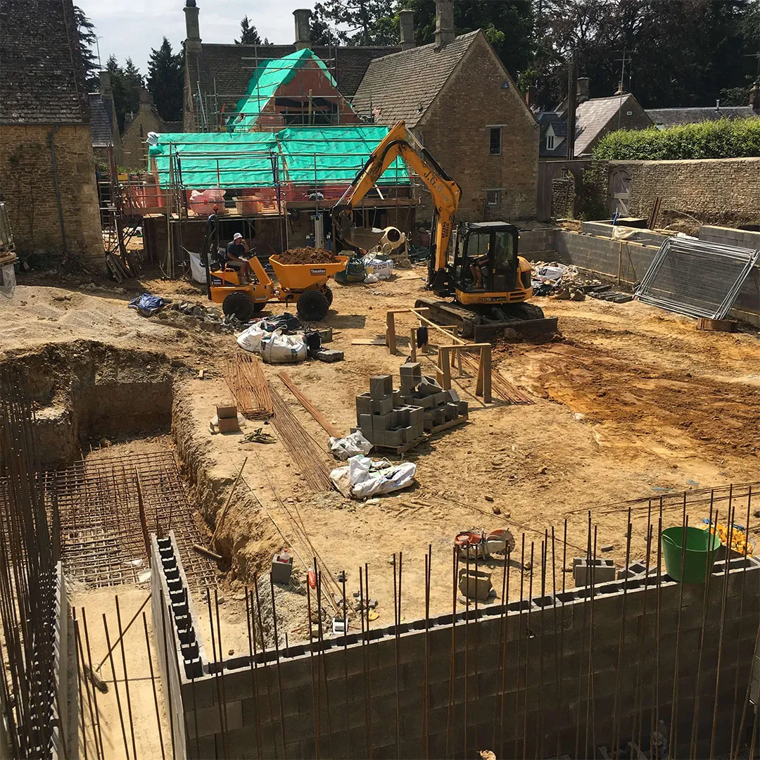 a construction site with construction equipment in the foreground