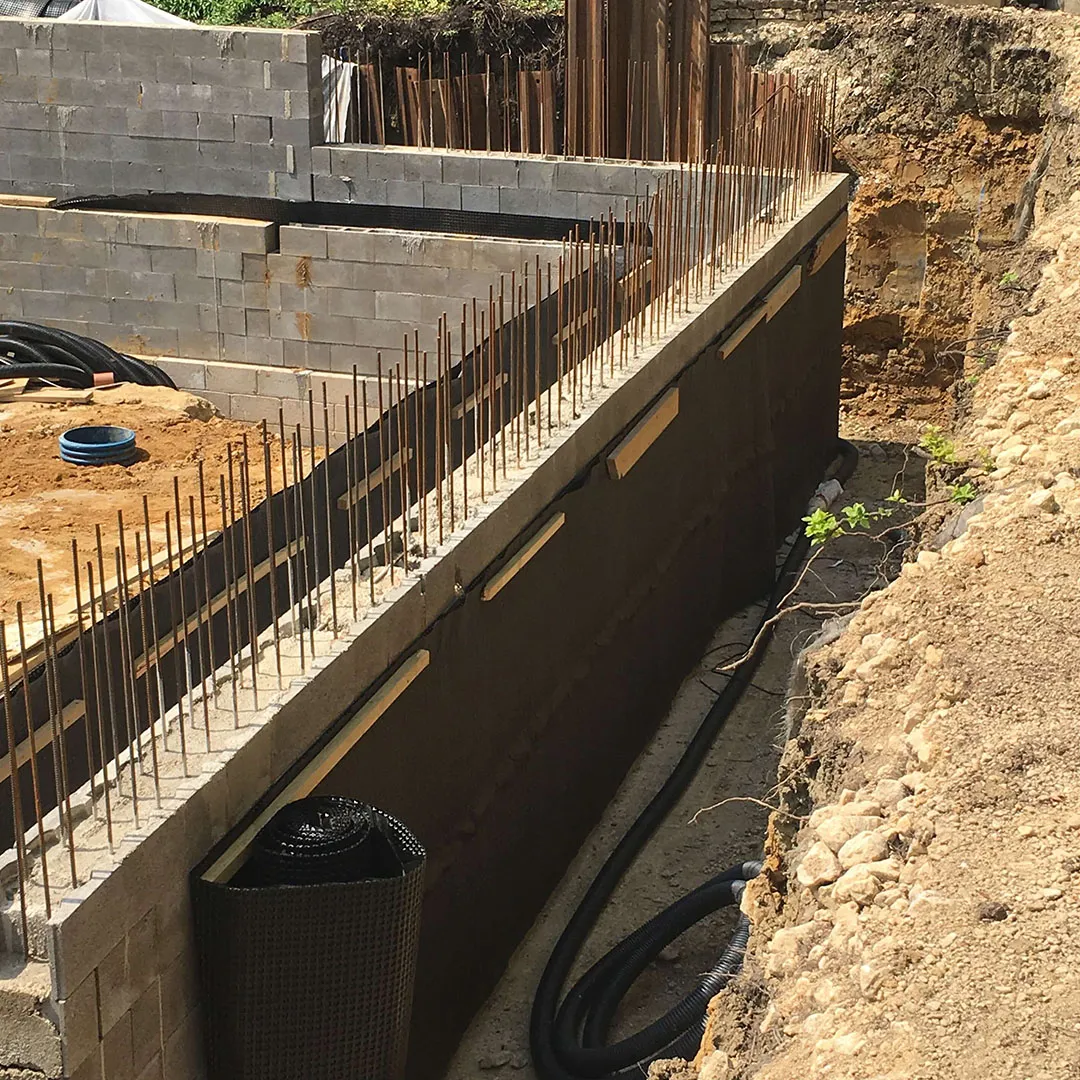 a building under construction with a hose attached to it