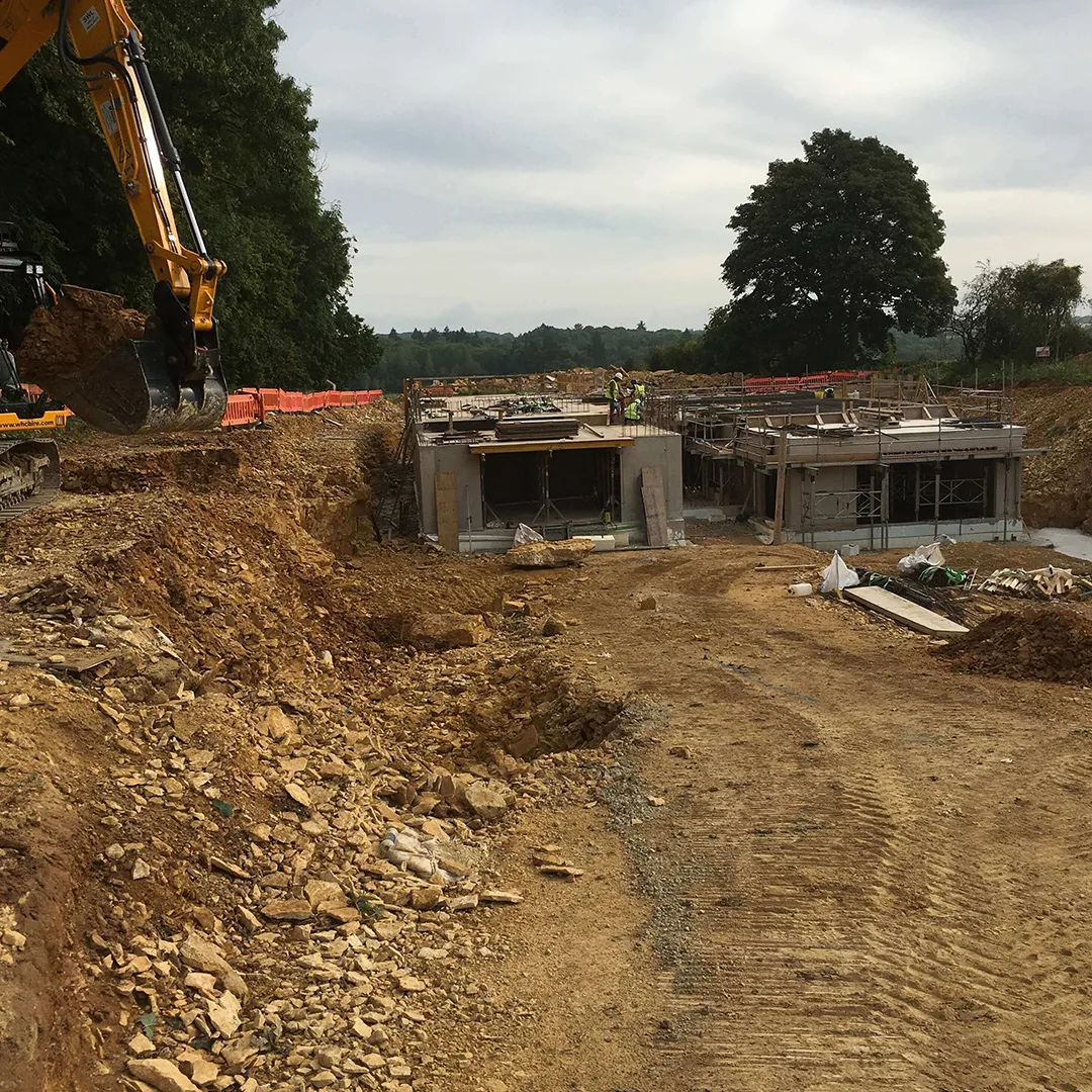 a construction site with a bulldozer and construction equipment